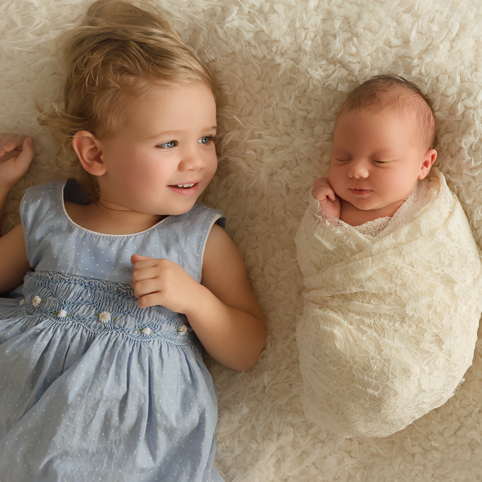 big sister, little sister, baby girl newborn session, photoblocks bed, wrapped baby newborn photos, Brisbane newborn photographer, newborn photography Brisbane, two year old sibling